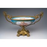 A large French Sèvres style gold layered 'bleu céleste' ground porcelain gilt bronze mounted oval