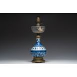 A Chinese blue and white bottle-shaped vase with floral design mounted as a lamp, Kangxi