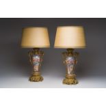 A pair of Chinese gilt bronze lamp mounted famille rose 'Mandarin' vases, Qianlong