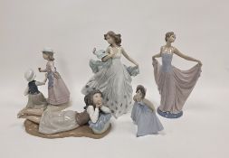 Five Lladro figures, printed marks, including: two tall figures of elegantly dressed ladies, a group
