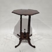 19th century mahogany side table, the octagonal top on four bobbin columns united by a shaped plinth