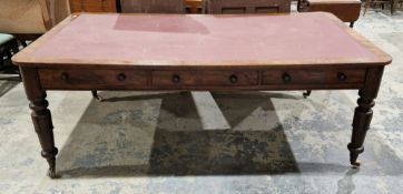 19th century mahogany library table, the top with inset burgundy writing surface and rounded corner,