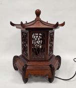 Hardwood table lamp in the form of a Chinese pagoda lidded lantern, with pierced side panels, 52cm