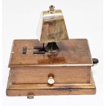 Early 20th century railway signal box block bell with brass cow type bell on a mahogany base, 26cm