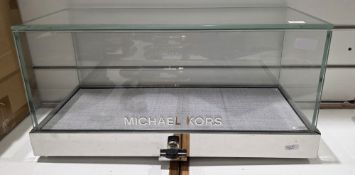 Contemporary Michael Kors counter top shop display cabinet of rectangular form, comprising five