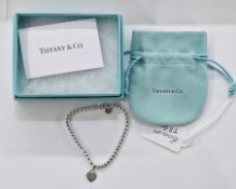 Tiffany & Co silver beaded ball bracelet for a child, with Tiffany & Co silver tag, 7.8cm long