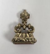 19th century yellow metal fob seal set with an unengraved rectangular carnelian, 3.5cm long