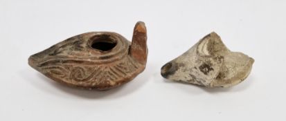 Roman red earthenware oil lamp, 200-300AD, decorated with foliate and chevron bands, with provenance
