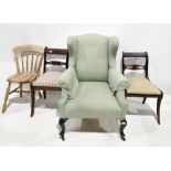 20th century wingback armchair, 109cm high, a pair of Regency-style mahogany dining chairs with