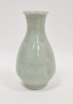 Jim Malone (1946-), a porcelain celadon glazed bottle vase, incised with panels enclosing