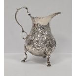 George II silver milk jug, London 1754, makers mark rubbed, of baluster form with acanthus leaf