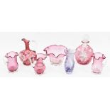 Collection of late Victorian cranberry tinted glass including a cut glass compressed oviform