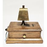 Early 20th century railway signal box block bell with brass cow type bell on a mahogany base, 28cm