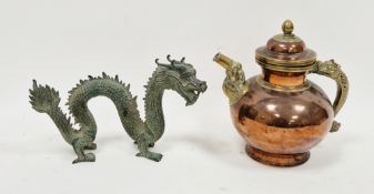 Chinese bronze model of a scrolling dragon, standing four-square with flaming tail, 27cm long and