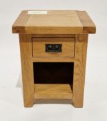 Contemporary oak bedside table of square section with frieze drawer