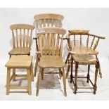 A collection of four chairs and two stools including a Windsor lath-back elbow chair, 111cm high x
