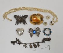 Small selection of costume jewellery to include a continental white metal charm bracelet, a