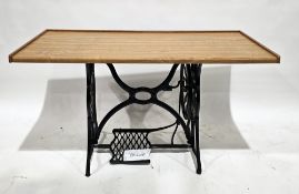 Modern oak-topped desk/table, having a low three-quarter gallery rail, on a 19th century cast iron