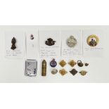 Collection of military items and commemorative items including four military cap badges including