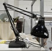 Black metal anglepoise lamp with weighted base