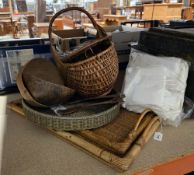 Group of wicker baskets, two woven rattan bamboo rectangular trays, a pair of carved wood salad