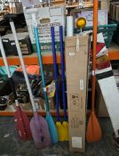 Boxed flagpole with rope, a collection of paddles, a football, a Wilson tennis racket Roger