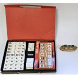 Boxed Mahjong set together with a small wooden boat