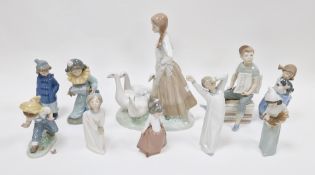Collection of Lladro and Nao porcelain figures including a large Spanish porcelain figure of a goose