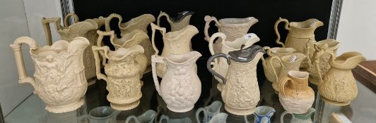 Collection of Victorian pottery caneware and stoneware relief-moulded jugs in sizes, variously