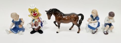 Three Royal Copenhagen figures of children including a seated girl holding an icecream, model no.