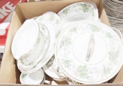 Noritake Daphne part dinner service decorated with green leaves and brown flowers on a white ground,