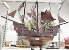 Wooden-effect model of a galleon on stand, 59cm high