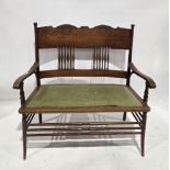 Late 19th/early 20th century Arts & Crafts oak two-seater settee having a deep carved toprail and