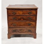 Walnut chest of drawers in the George III manner, the burr walnut veneer top with feather and