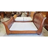 Frank Hudson mahogany kingsize sleigh bed, the headboard and footboard with scrolling ends and