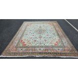 Lot Withdrawn - Large green ground carpet with central floral motif, on floral field, spandrels