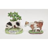 Staffordshire pearlware model of a setter, circa 1820, the black and white dog modelled standing