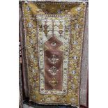 Modern green ground prayer rug with three floral motifs on hooked design field, multiple floral