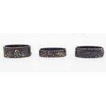 Three Japanese sword fittings (Fuchi), Edo period, cast in relief and inset with gilt decoration,