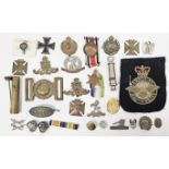 Mixed lot of medals, military cap badges and other items, including a faithful service in special