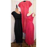 Black crocheted maxi dress over a black lining, labelled 'Young Mayfair, Hershelle', empire line