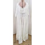 Edwardian silk nightgown with lace detail, with silk ribbon threaded through the waist and the
