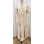 1920's/30's dress and jacket, pale apricot with lace inserts, the leg o'mutton-style sleeves with