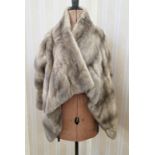 WITHDRAWN - A grey mink evening jacket, with a full front, and pockets, elbow length sleeves The