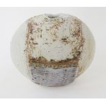 Alan Wallwork (1931-2019), a stoneware pebble form vase, enriched in a pale blue-grey iron and cream