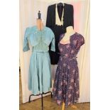 A selection of 1940's vintage dresses to include navy blue printed with pink bouquets of flowers and