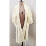 A cream mink stole, with a silver embroidered lining