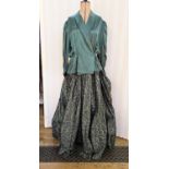 Hardy Amies dark green satin skirt decorated with silver whorls, with a dark green satin matching