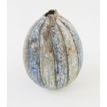 Alan Wallwork (1931-2019), a stoneware seed pod form vase, traces of incised AW mark, decorated in