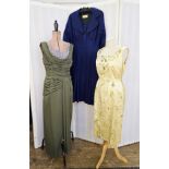 A yellow 1960's cocktail dress, embroidered with green and yellow flowers, satin belt with bow, a